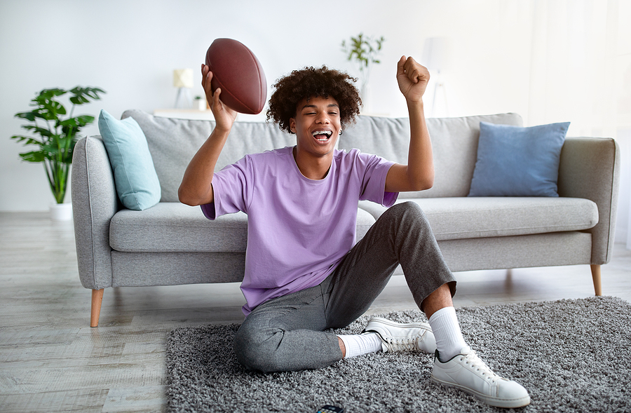 Football Fan Cheering on Team Address Scoop