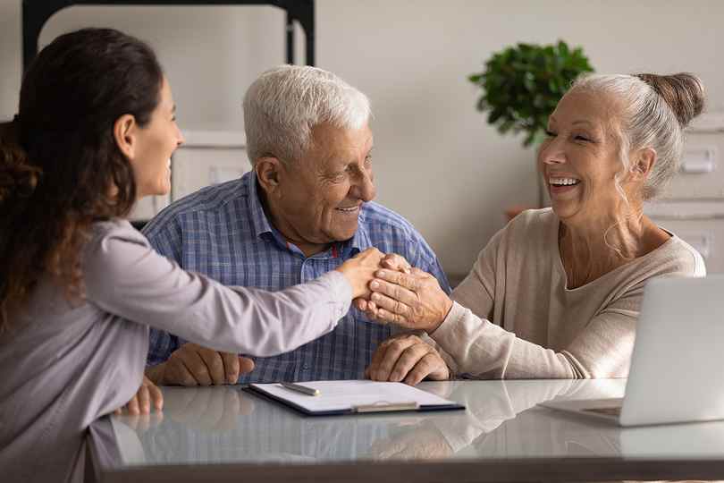 Real Estate Agent Helping Elderly Clients Address Scoop